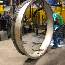 A Kelair worker welding a butterfly damper.