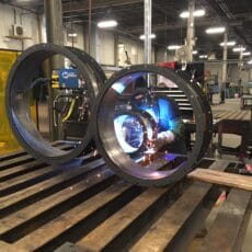 A Kelair shop worker welds an industrial damper.